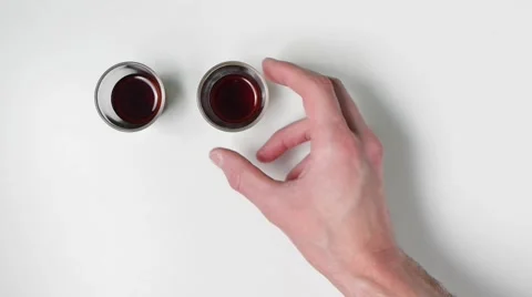 Drinking shots after taking a glass out of the frame. Stock Footage 46748892