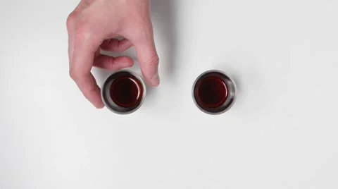 Drinking shots after taking a glass out of the frame. Stock-Footage 46748921