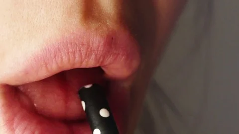 Drinking with straw, closeup Stock Footage 78392978