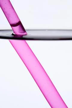 Drinking straw refracted by water Stock Photos