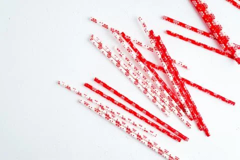 Drinking straws for party on white background. Top view of colorful paper str Stock Photos