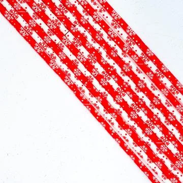 Drinking straws for party on white background. Top view of colorful paper str Stock-Fotos