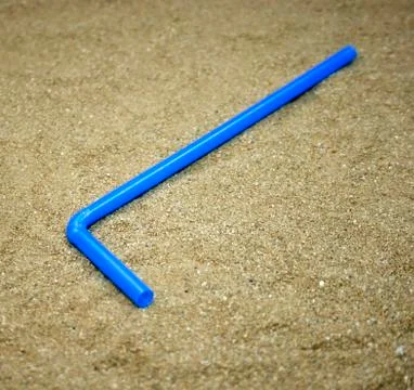 Drinking straws on sand Stock-Fotos