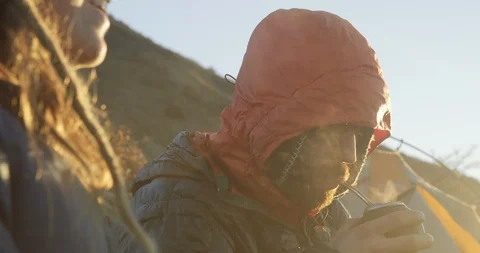 Drinking tea in the cold while camping Stock Footage 90405476