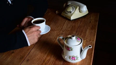 Drinking tea talking on the phone Stock Footage 114355587