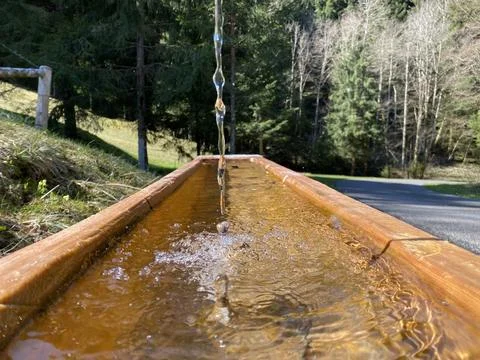 Drinking troughs with a water source for alpine cattle on the Pilatus Stock Photos