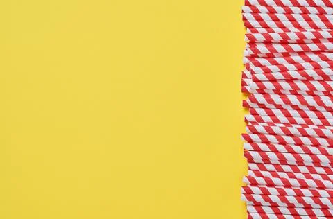 Drinking tubes made of red and brown paper and cornstarch, biodegradable mate 스톡 사진