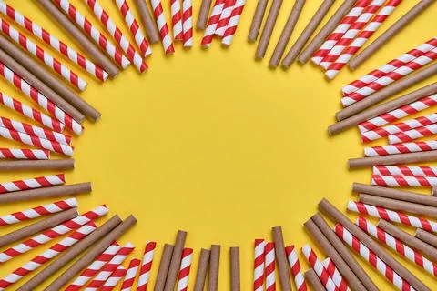 Drinking tubes made of red and brown paper and cornstarch, biodegradable mate 스톡 사진