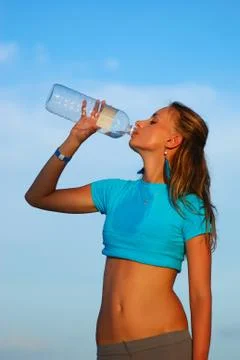 Drinking water after jogging Stock Photos