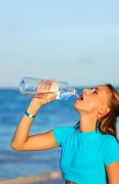 Drinking water after jogging Stock Photos