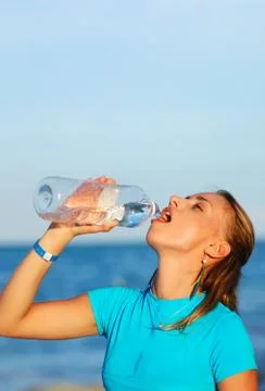 Drinking water after jogging Stock Photos