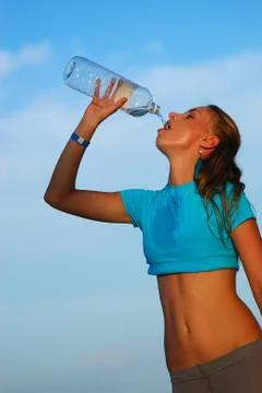 Drinking water after jogging Stock Photos