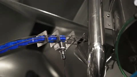 Drinking water bottling production. Screws the plastic cap onto the bottle. Stock Footage 162760867