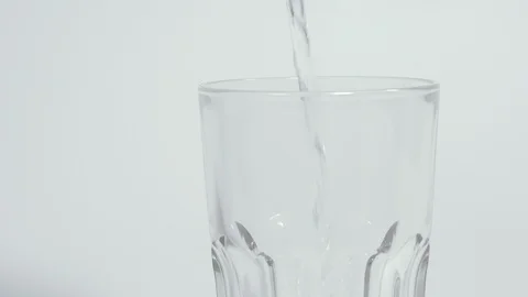 Drinking water. Drinking water is poured into a glass. Stock Footage 128941111