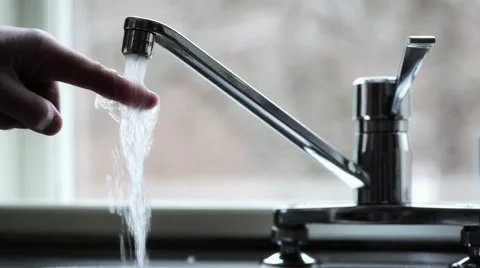 Drinking water from kitchen tap. Video stock 1058671