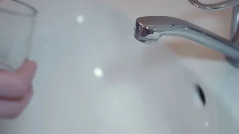 Drinking water from kitchen tap Stock Footage 85281291