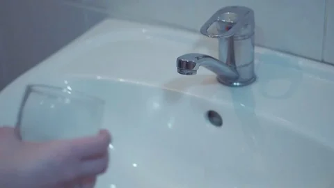 Drinking water from kitchen tap Stock Footage 85281325