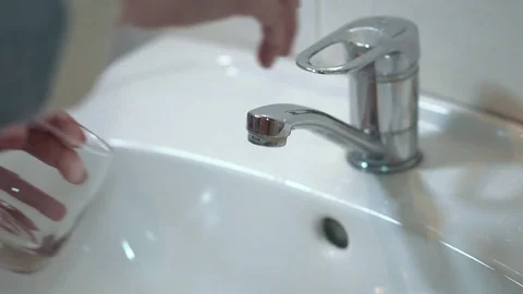 Drinking water from kitchen tap Stock Footage 85281493