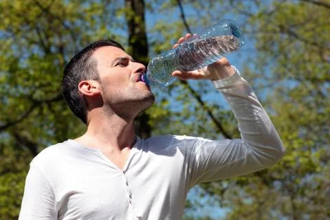 Drinking water in a park Stock Photos