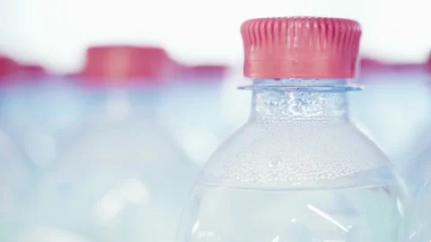 Drinking water in plastic bottles. Close-up. Stock Footage 144680524