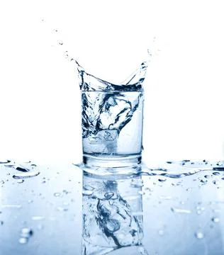 Drinking water splashed with ice in glass Stock Photos