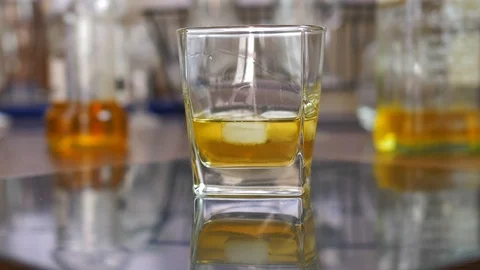 Drinking Whiskey with Ice Cubes from Drink Glass Slow Motion Video stock 119015634