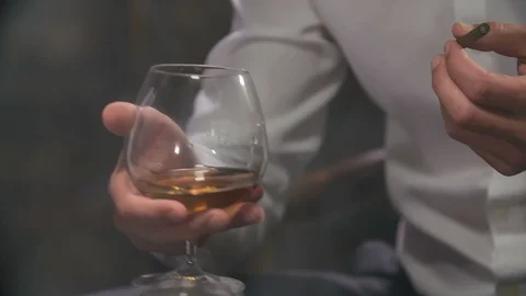 Drinking whisky and smoking cigarettes Stock Footage 112200063