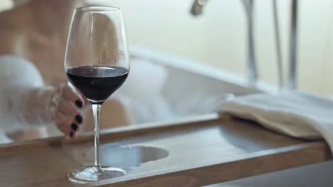 Drinking wine in bath tube. Stock Footage 162682170
