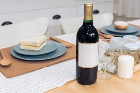 Drinking wine bottle on dining table. Beverage and food concept. 写真素材