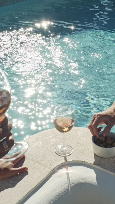 Drinking wine by the pool Video stock 235747636