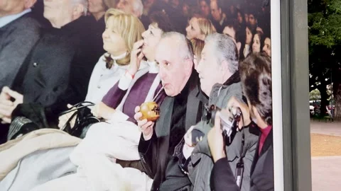 Drinking yerba mate pope francis religious artwork in plaza pueyrredon buenos Stock Footage 327542021