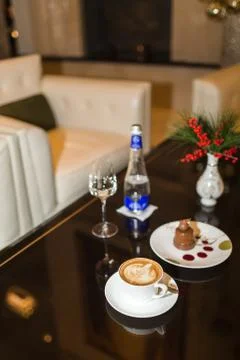 Drinks and desserts on table in cafe Stock Photos