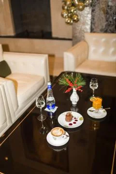 Drinks and desserts on table in cafe Stock Photos