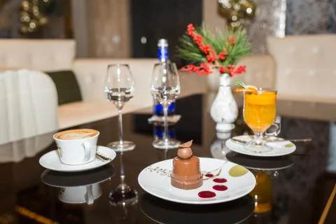 Drinks and desserts on table in cafe Stock Photos