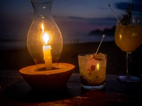 Drinks on the beach by candlelight Stock Photos