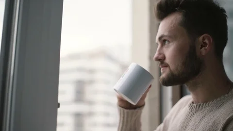 Drinks coffee at home1 Stock-Footage 129463852