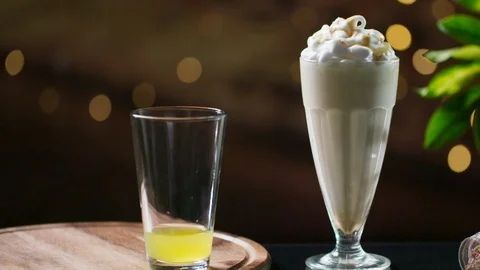 Drinks: pouring orange sparkling lemonade into glass, Milkshake Coffee Ice Cream 스톡 동영상 122371601