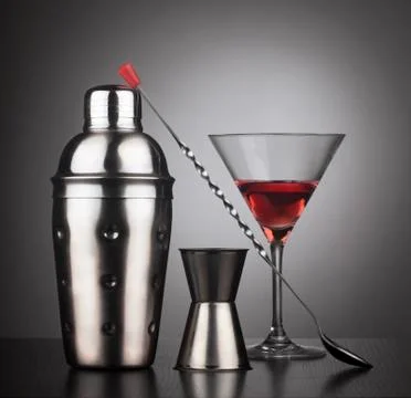 Drinks shaker with cocktail tools and glass Stock Photos