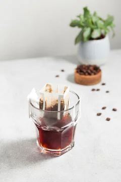 Drip coffee bag in a mug. Trends in brewing coffee at home. Stock Photos