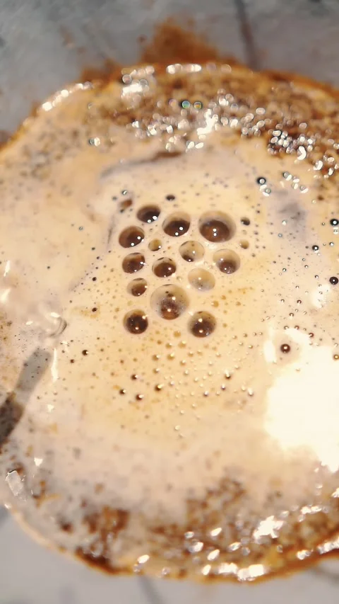 Drip coffee brewing. close-up. barista pours boiling water from a special kettle Stock Footage 323436879