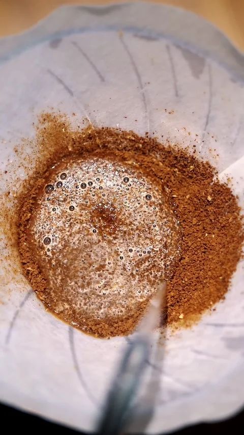 Drip coffee brewing. close-up. barista pours boiling water from a special kettle Video stock 323514248