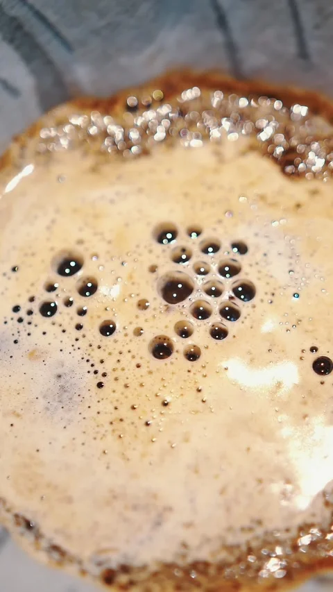 Drip coffee brewing. close-up. poured with boiling water, freshly ground, coffee Stock Footage 323514391