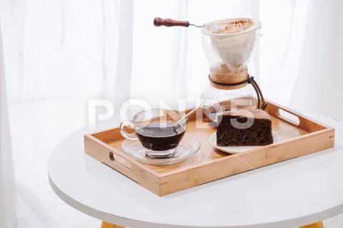 Drip coffee (dripper) and drip ground coffee with glass drip pot, cup and cho Stock Photos