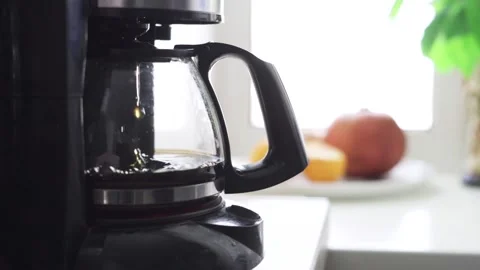 A drip coffee maker brewing coffee close-up Stock Footage 171987988
