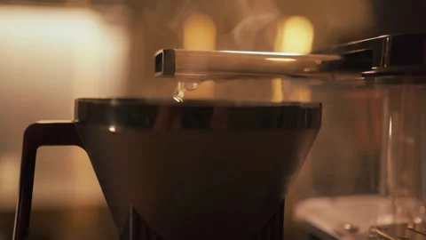 Drip coffee maker brews freshly brewed coffee in the kitchen. Fresh hot coffee Stock Footage 267022004