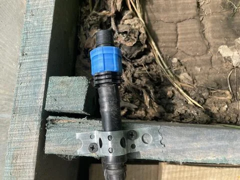 Drip irrigation tape connection fitting close-up Stock Photos