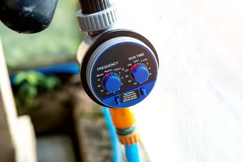 Drip irrigation timer close-up. Organic farming Stock Photos