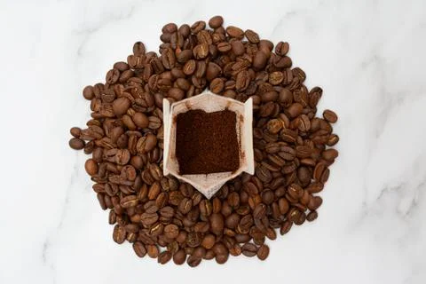 Drip pack stands on roasted coffee beans. The concept of delicious and Stock Photos
