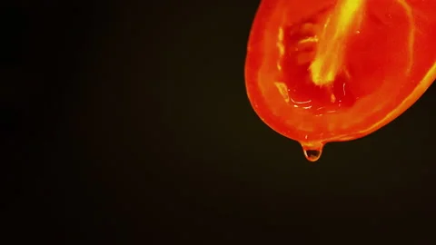 Drip ripe red sliced ​​tomatoes. healthy food macro shots Stock Footage 196676186