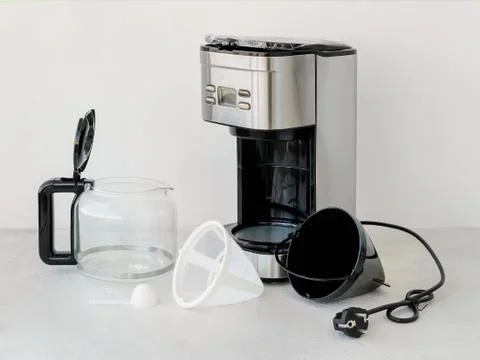 Drip-type coffee maker comprises on a table Stock Photos